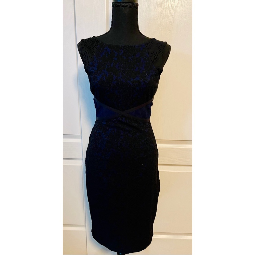 Black lace with blue underlay dress. Like new. Size two. Sleeveless.
